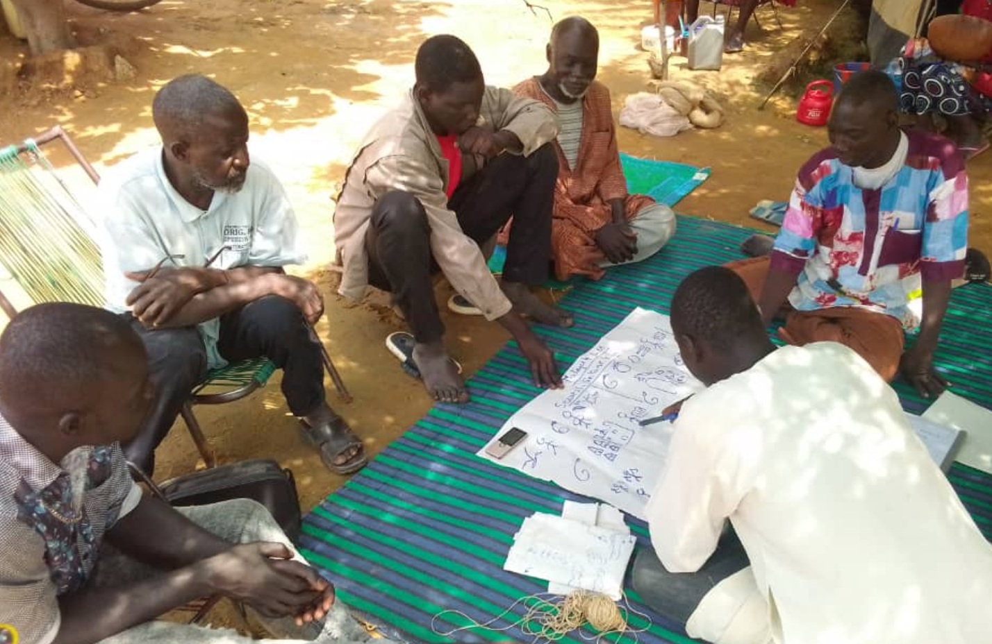 three women carrying basin while walking barefoot